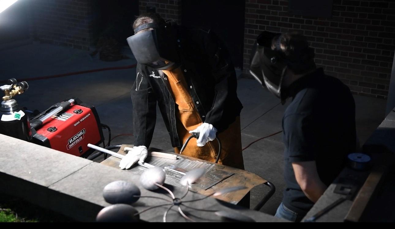 Student learning to weld in an Ideaworks Lab at Washington College